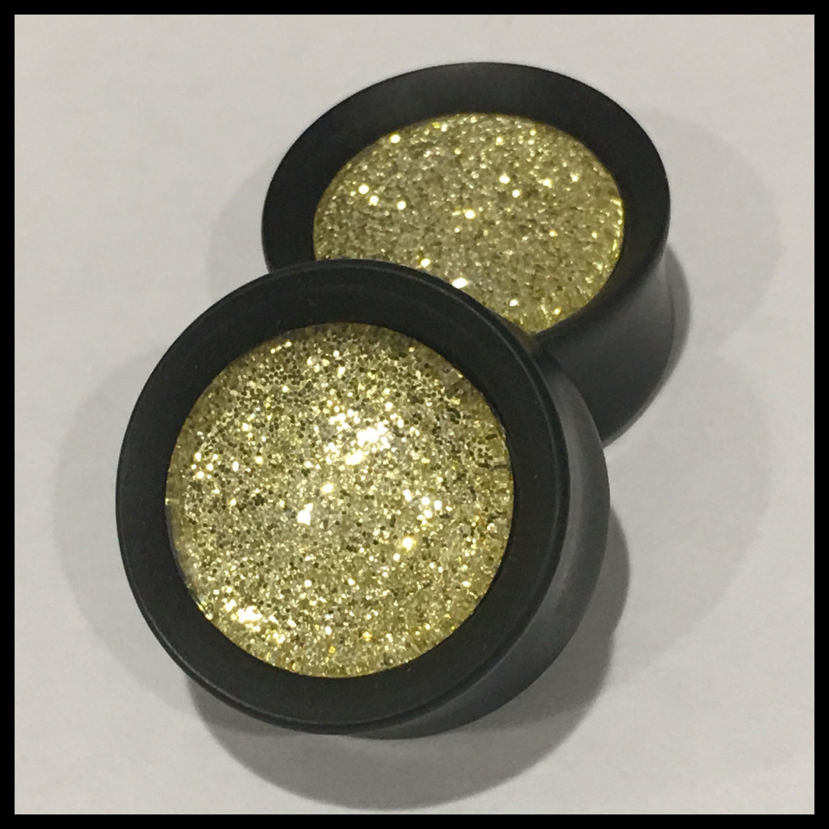 Ebony Gold Sparkle Round Plugs